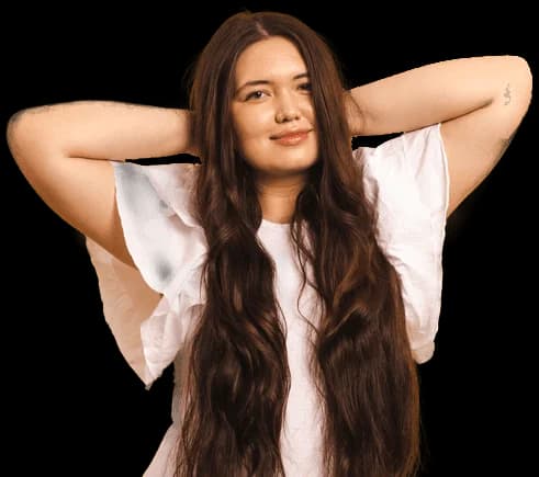 Plus-sized woman in one-piece with arms up, hands behind head, smiling