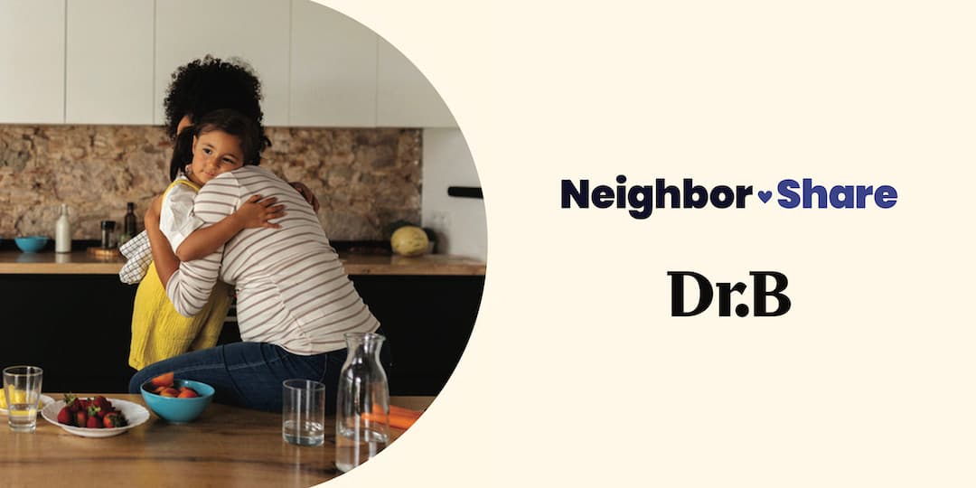 A banner image where a photo on the left shows a young Black mother embracing her toddler daughter in a kitchen. On the right are the words NeighborShare Dr. B.